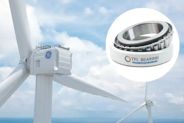 Large wind turbine with its generator set, highlighting the need for electrically insulated bearings to manage shaft currents