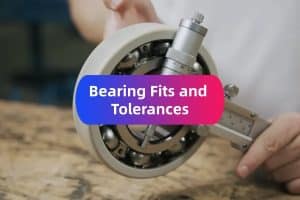 Engineer using a precision micrometer to measure the shaft fit for an electric motor bearing to ensure reliability.